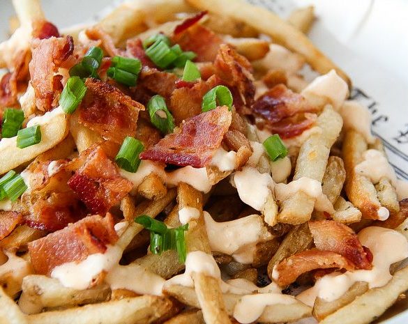 french fries topped with bacon