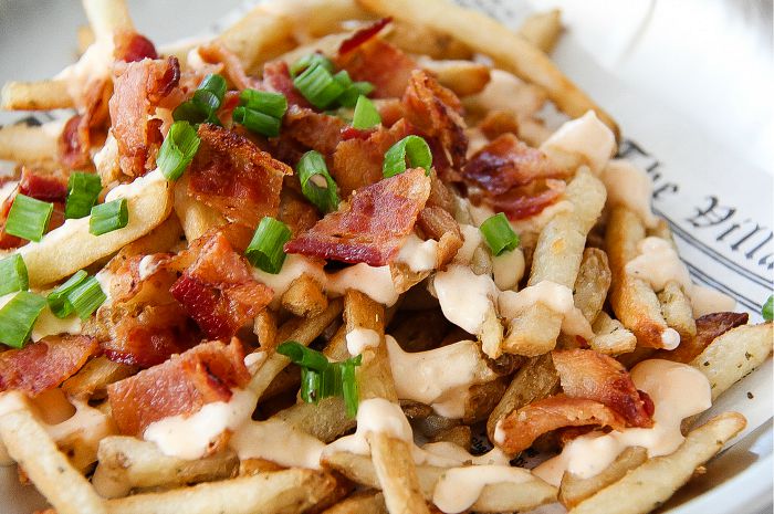 french fries topped with bacon