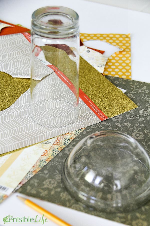 assorted sizes of glasses used as a template to cut out paper flowers