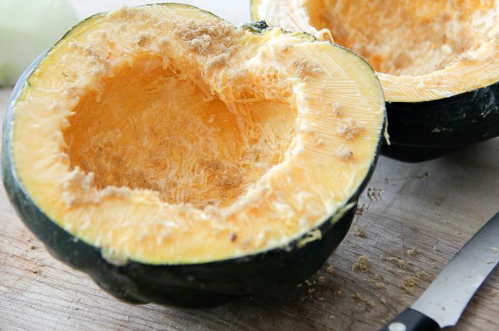 acorn squash halved with seeds removed