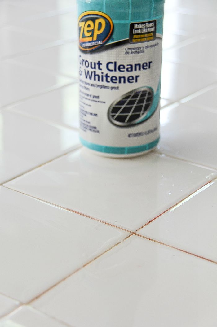 white kitchen tiles with a bottle of zep grout cleaner