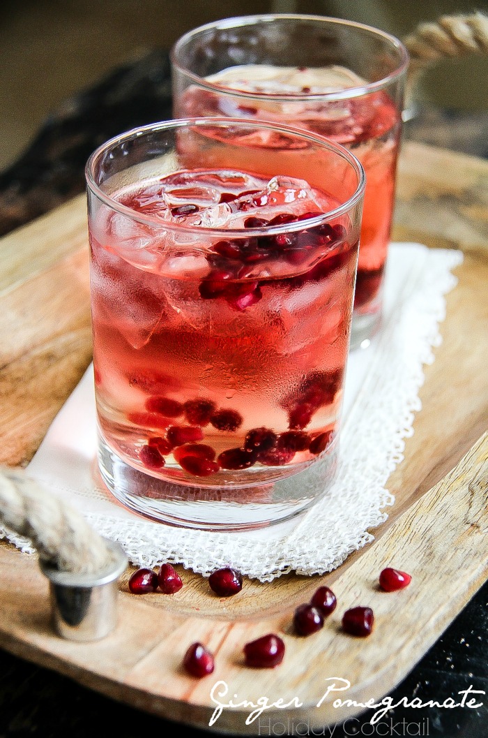 a pomegranate cocktail in a glass with real pomegranate