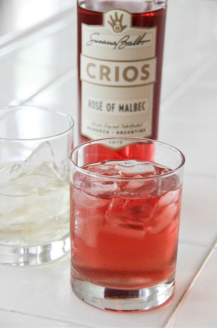 ginger ale in one glass with ice, rose malbec in another glass with ice