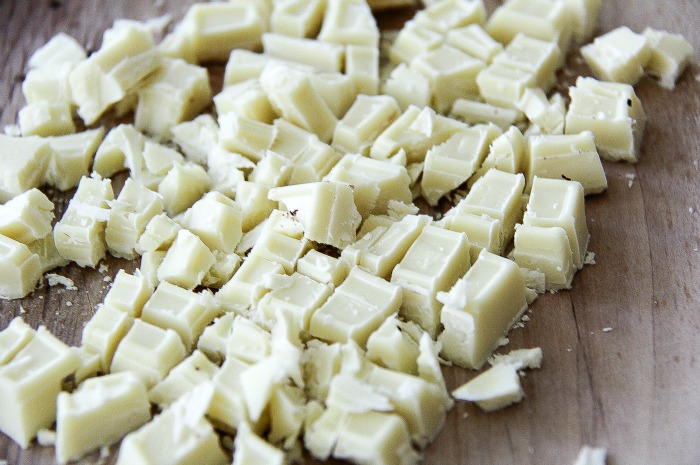 roughly chopped white chocolate on a cutting board