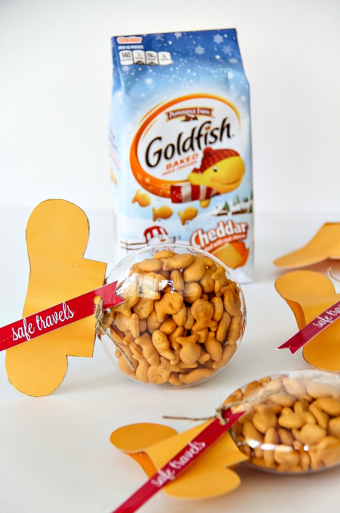 goldfish crackers in a clear ornament shaped like a yellow fish