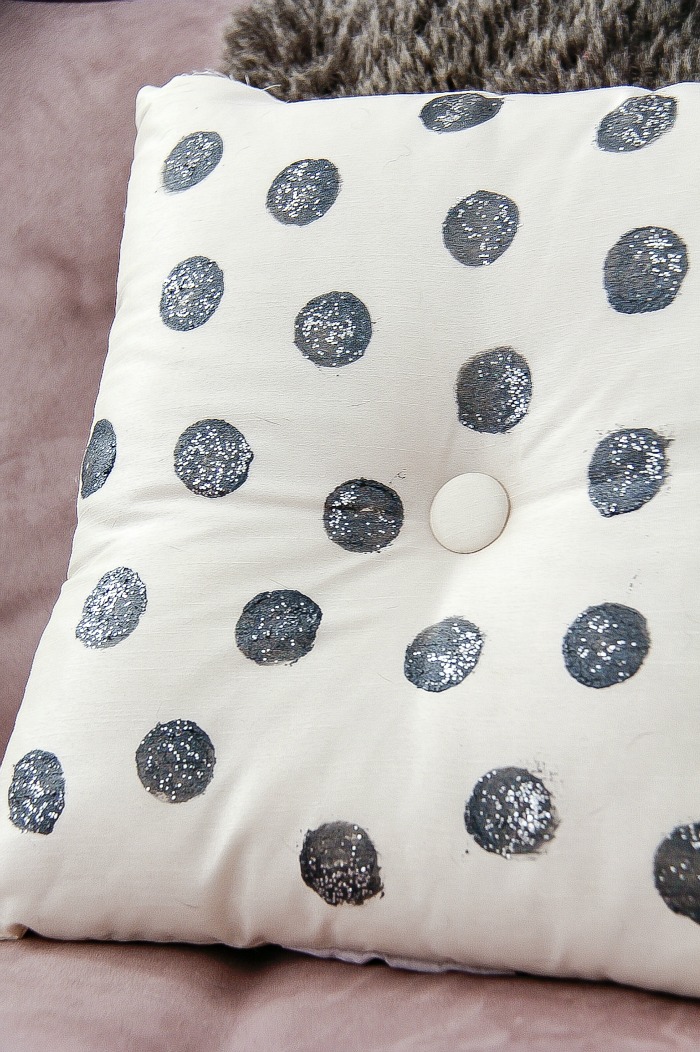 silver glitter spots on a white cushion