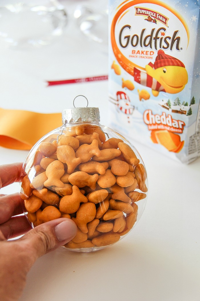goldfish crackers in a clear christmas ornament