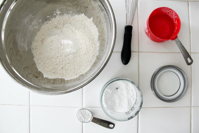 ingredients in bowls with a whisk to make scones