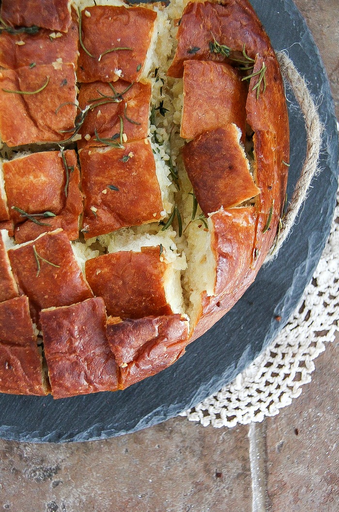 garlic rosemary pull apart bread on a tray