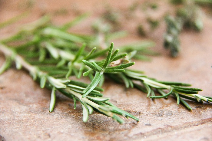 fresh rosemary on a cutting board