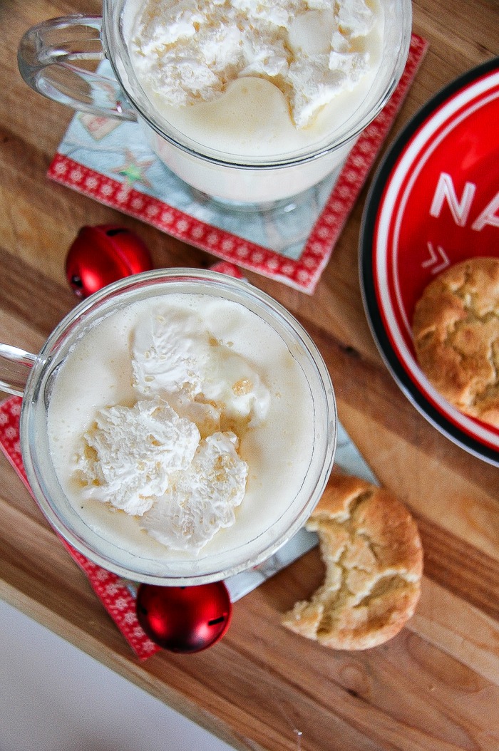 looking down over a white hot chocolate and a plate of sugar cookies