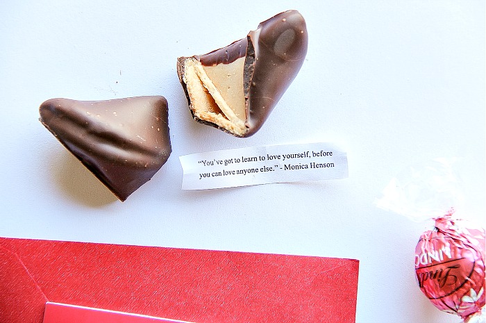 a chocolate coated fortune cookie with a message about loving yourself