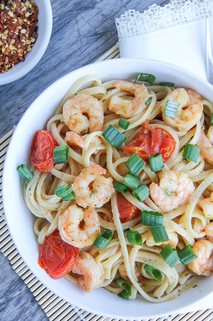 shrimp, pasta, and tomatoes in a bowl served for a meal