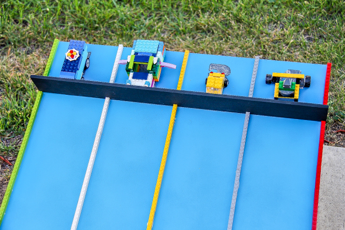 A handmade race track for racing LEGO cars.