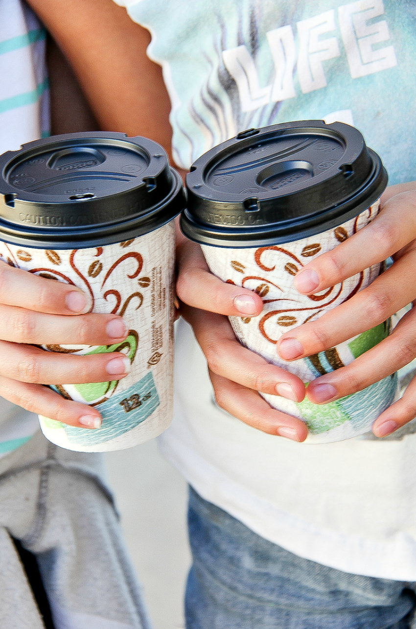 Hands holding Dixie To Go cups