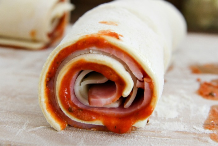 puff pastry rolled with ham, cheese, and pizza sauce