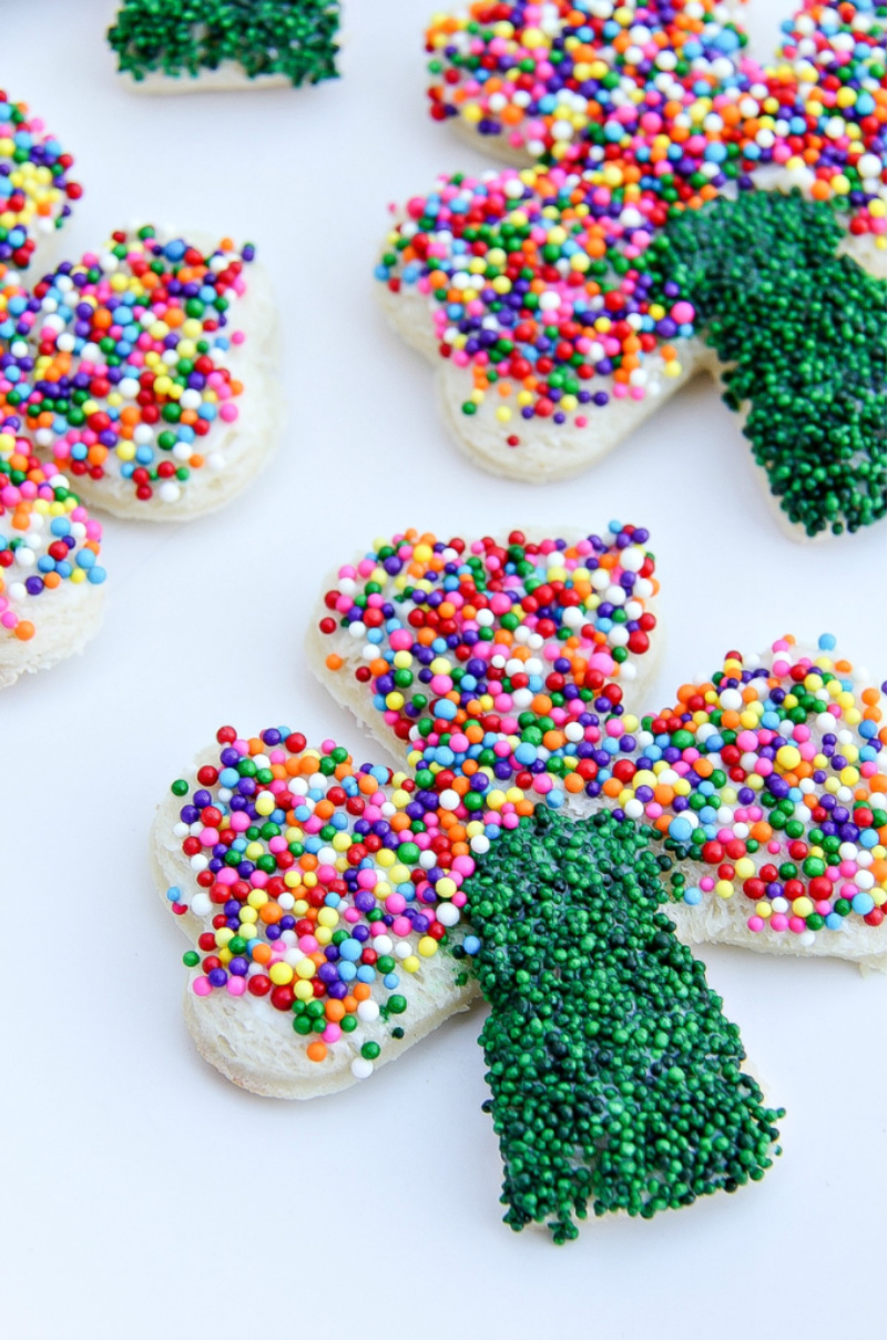 rainbow sprinkle shamrock shaped fairy bread treats for St. Patrick's Day.