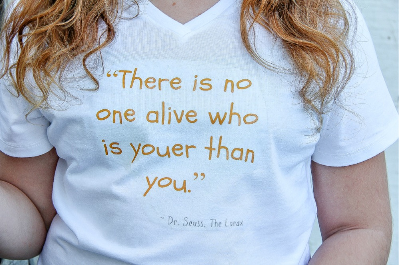 a white tshirt that has the quote there is no one alive who is youer than you