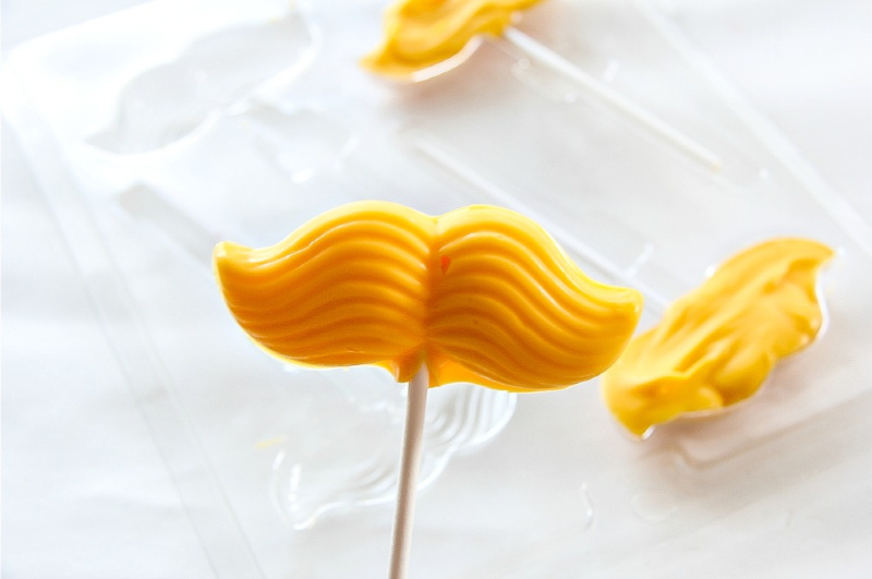 a yellow candy lollipop inspired by The Lorax