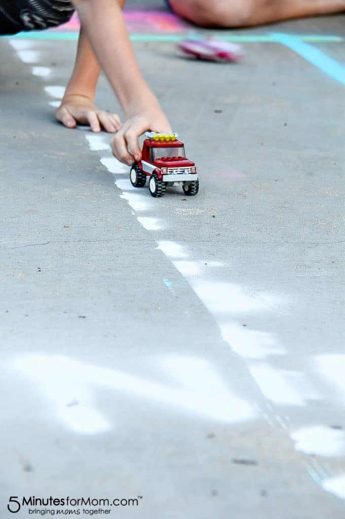 spray chalk race track on a driveway