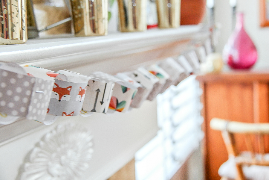 Thanksgiving paper chain hanging above a fireplace.