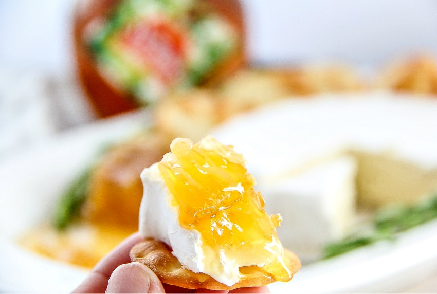 honeycomb, brie, and cracker appetizer.