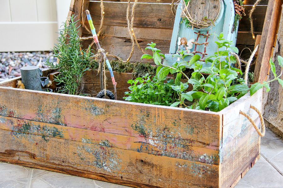 A fairy garden in a wood box