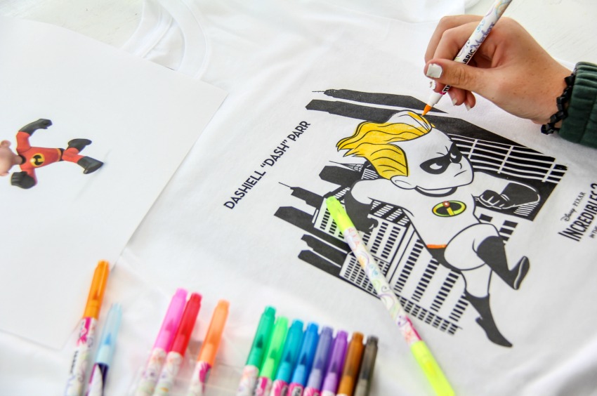 an Incredibles coloring page printed onto a tshirt for kids to color in