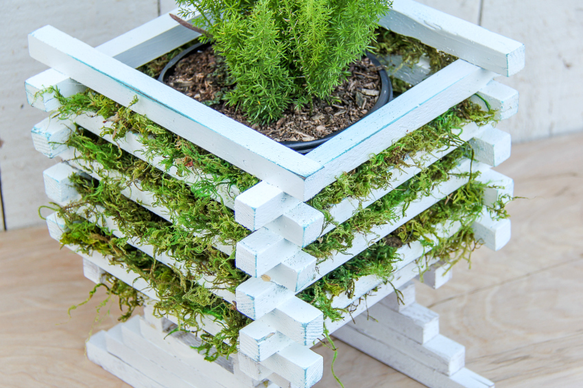 DIY plant stand made out of wood sticks