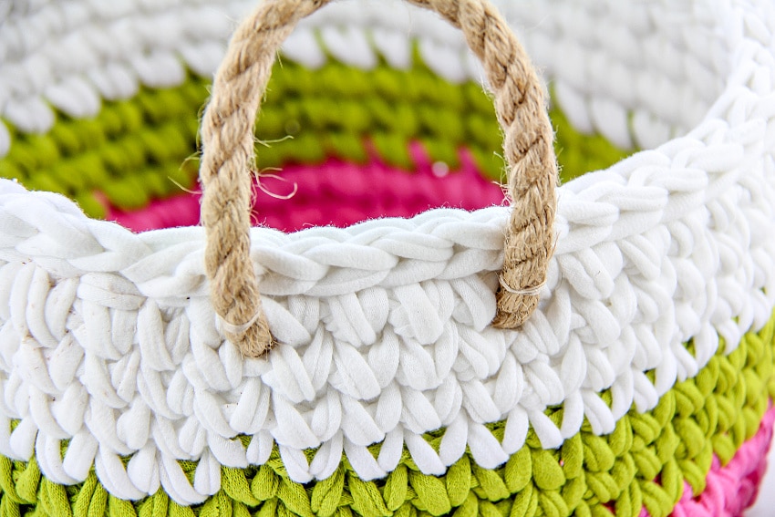 crochet basket in white, green, and pink with cord rope handles