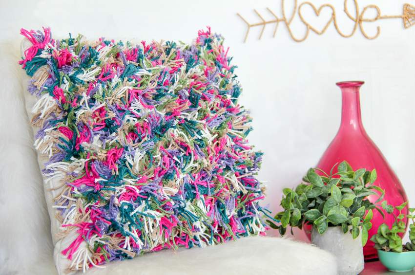 a colorful yarn cushion