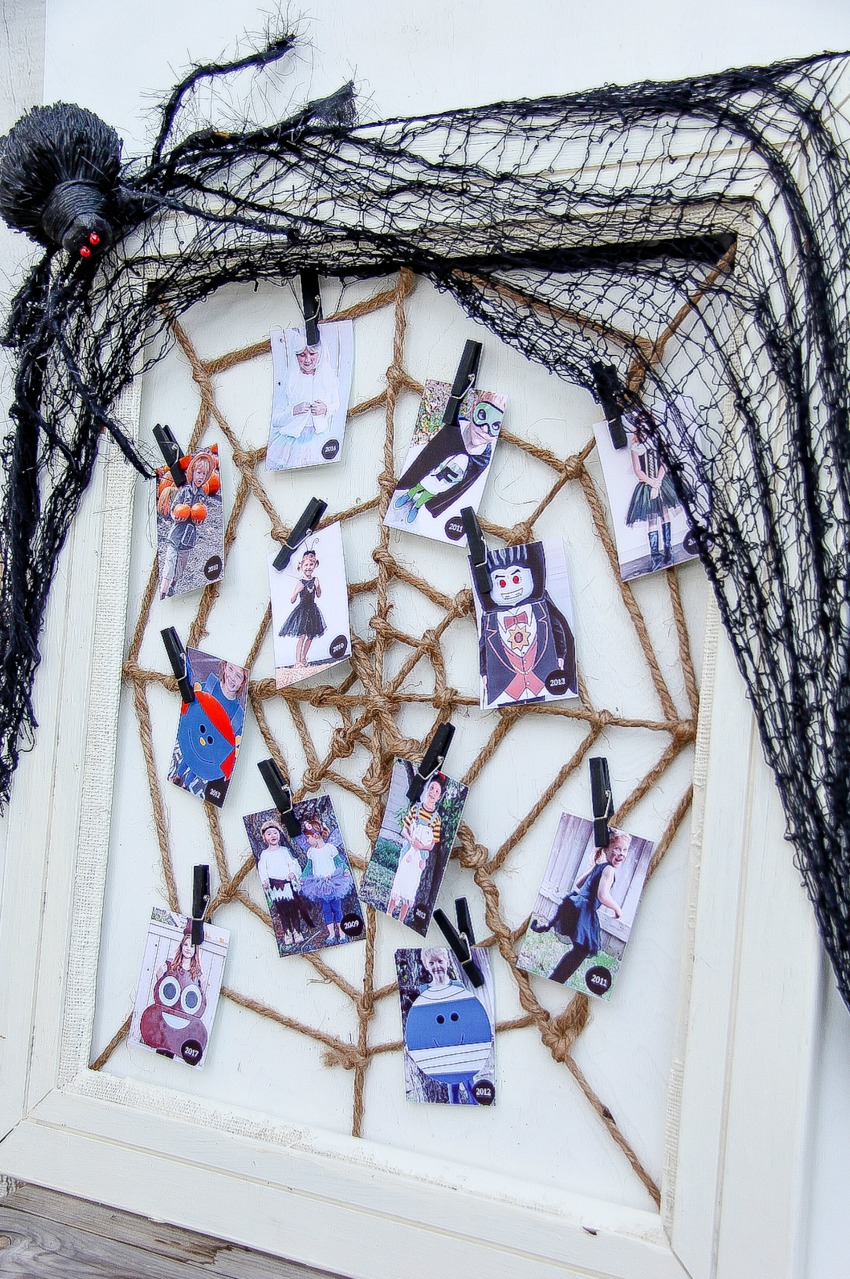 Handmade Halloween picture frame spiderweb to display photos.