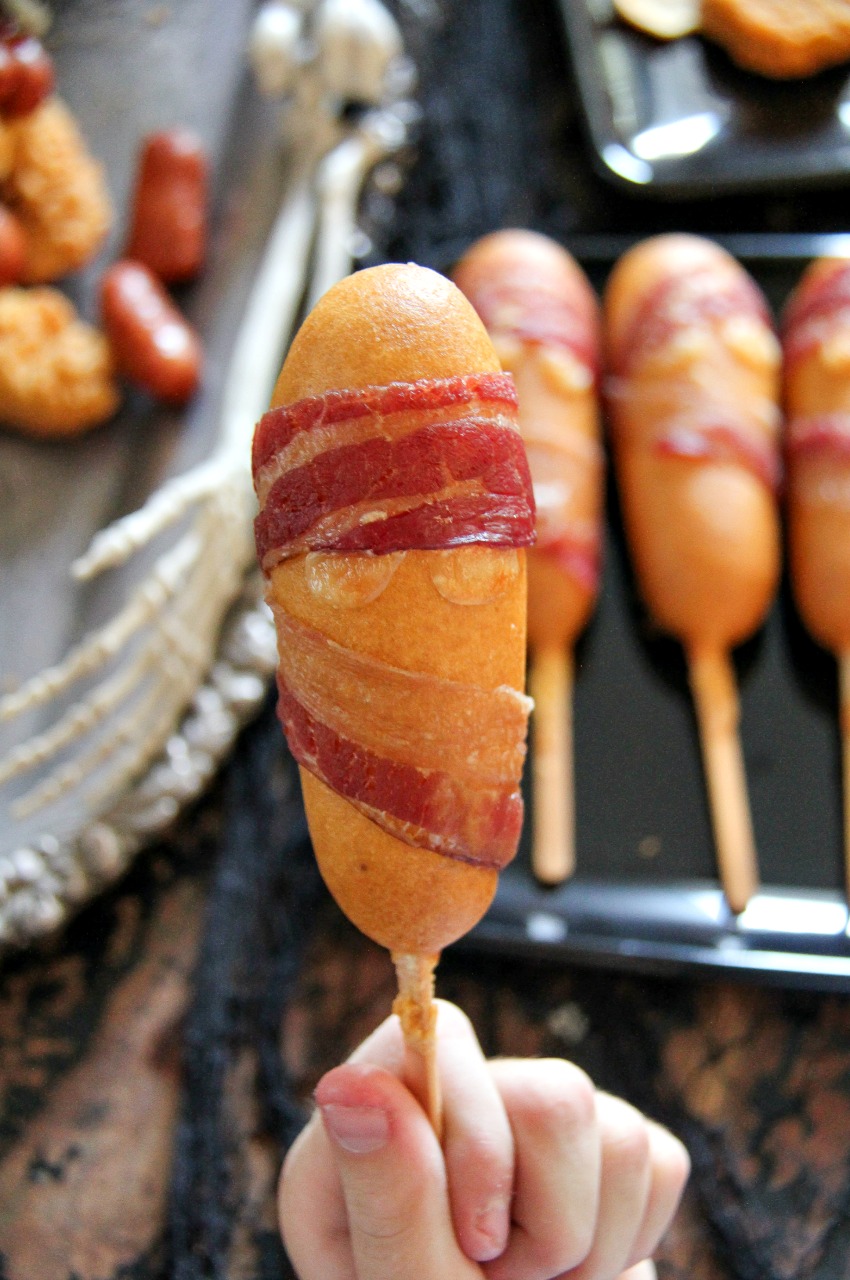 Mummy corn dogs for a Halloween party.