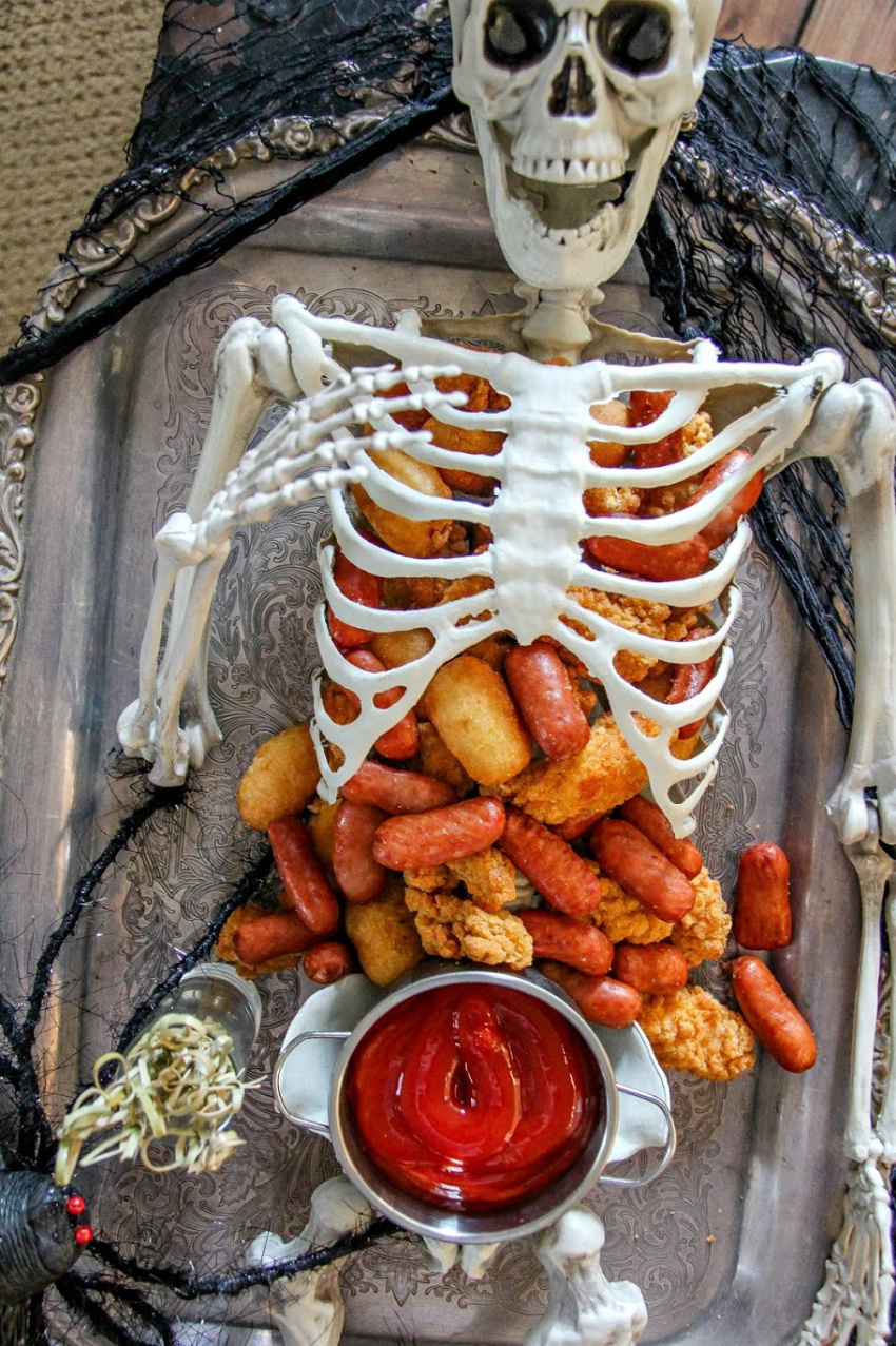 Halloween party food inside a skeleton for a party.