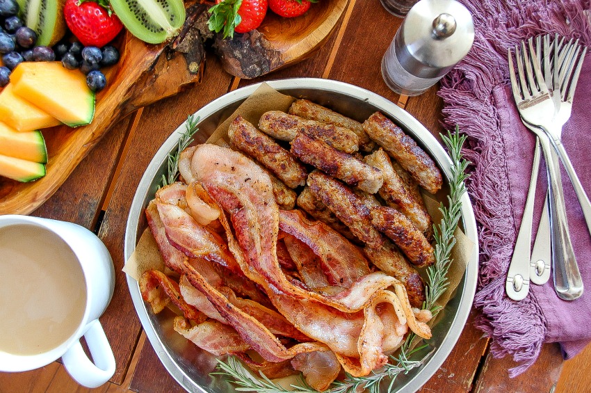 bacon and sausage on a tray for brunch