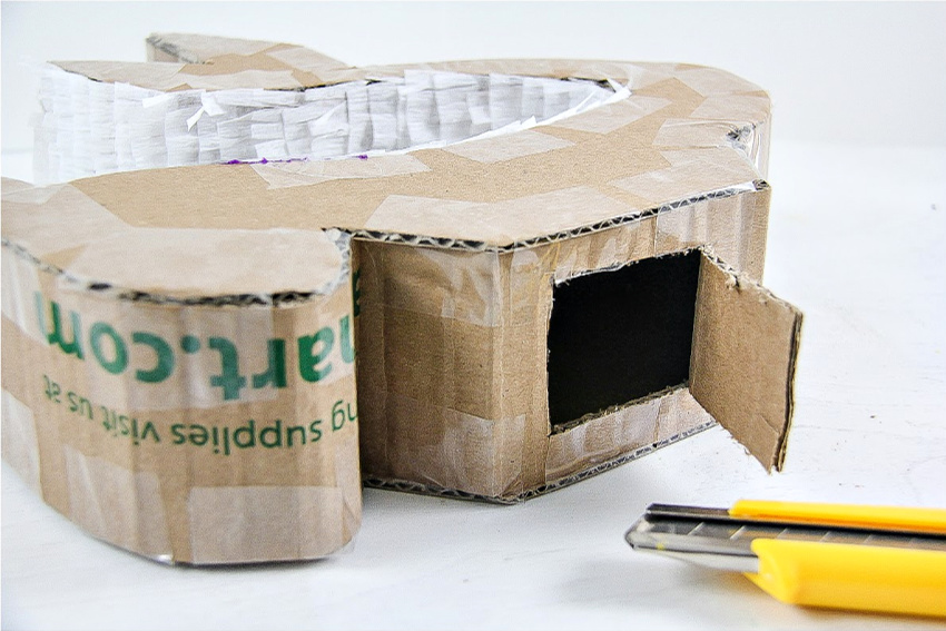 A step by step tutorial for how to make a pinata out of a cardboard box.