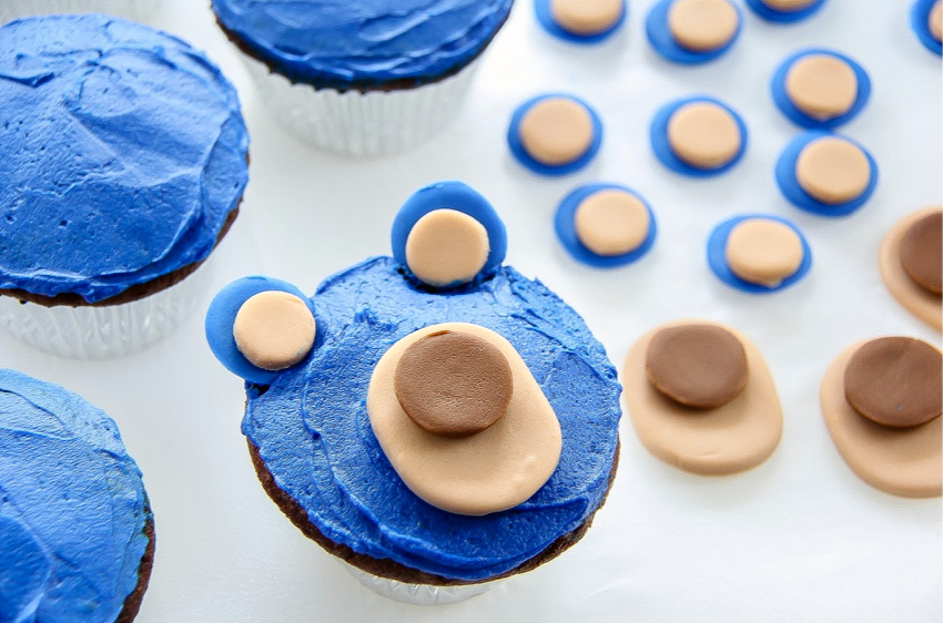 Bear cupcakes being formed using chocolate cupcakes and fondant.