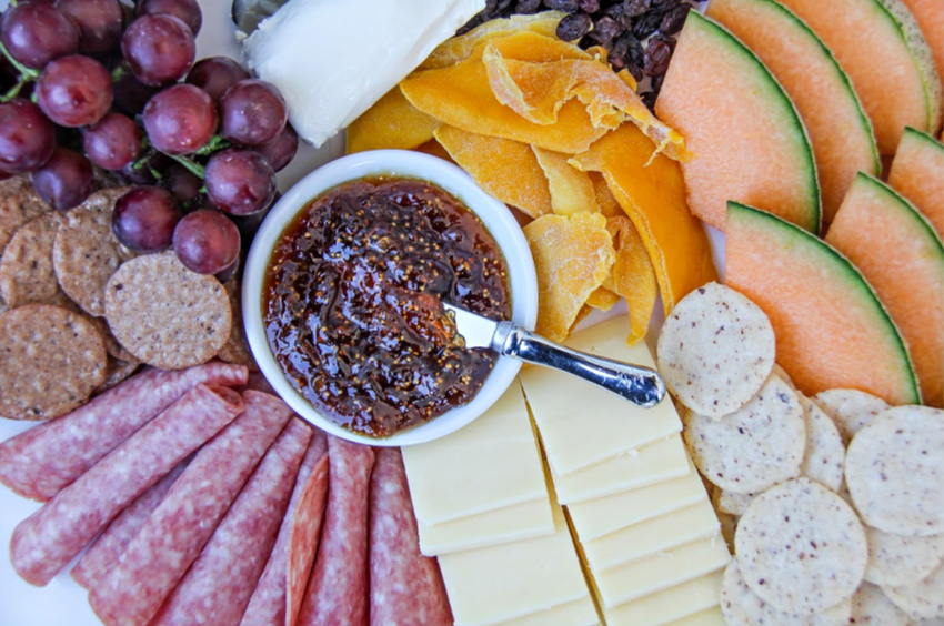 A gluten-free charcuterie board with gluten-free crackers.