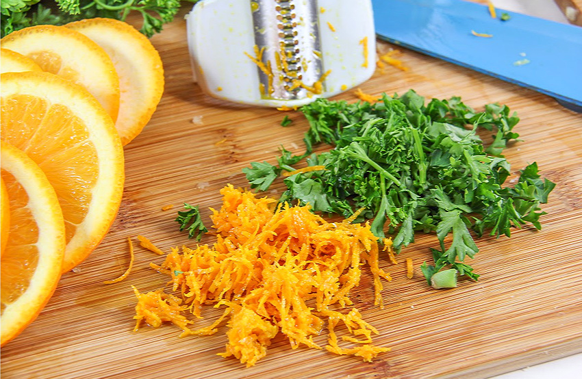 Orange rind and parsley being used in homemade citrus cauliflower rice.