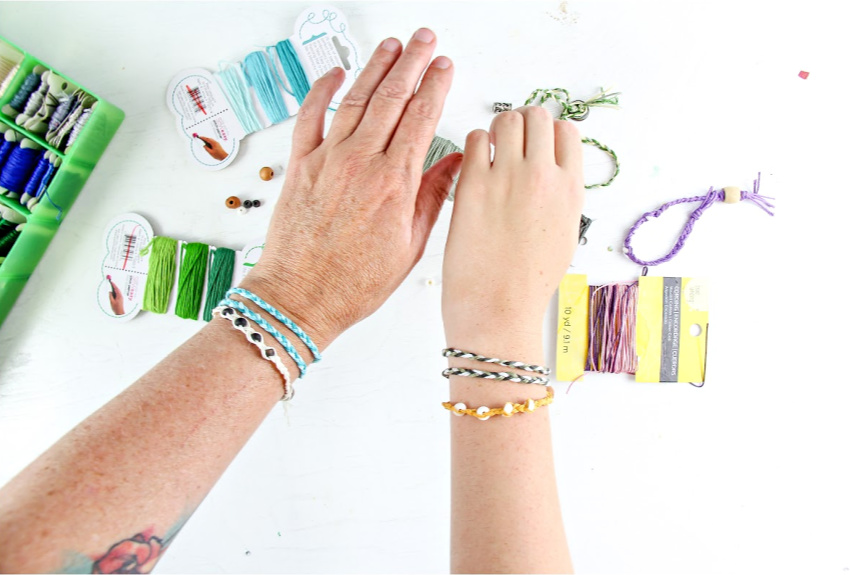 Handmade friendship bracelets made out of thread and beads.