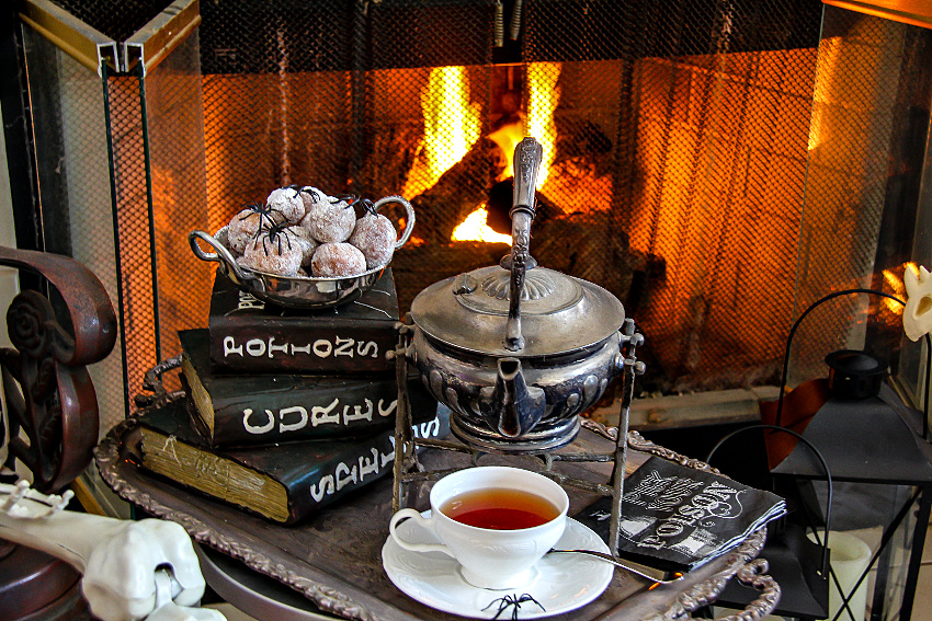 Halloween brunch idea including spider donuts and tea.