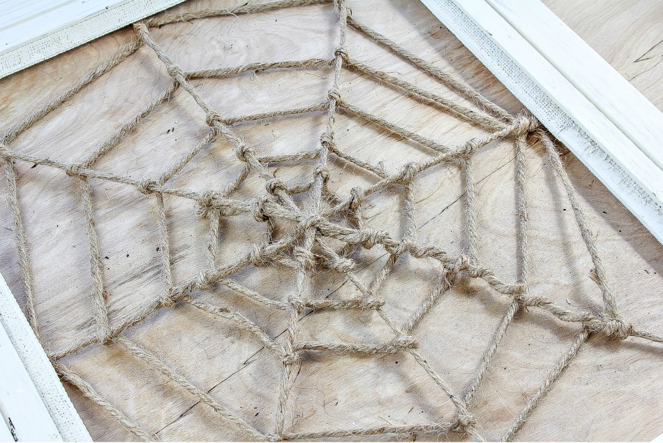 Spiderweb photo frame being made using hemp cord.