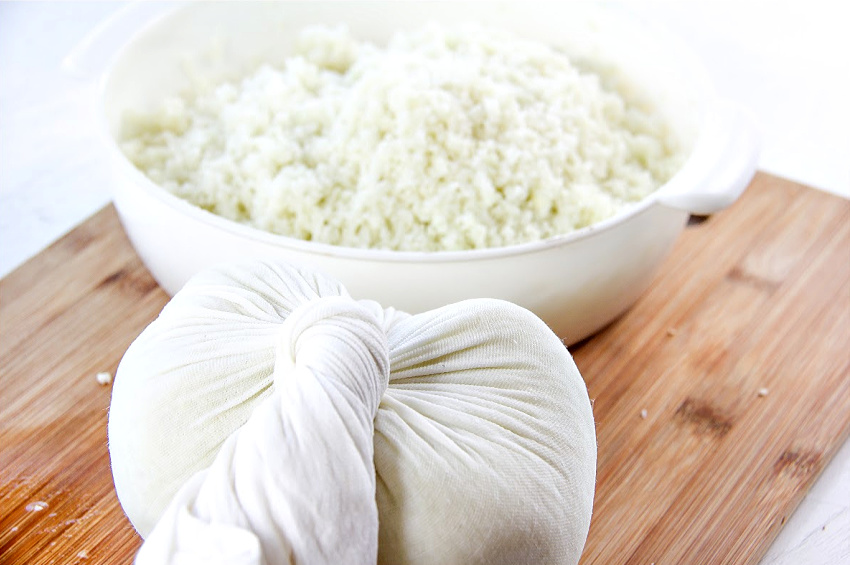 Cauliflower in a bag to squeeze out water for making pizza.