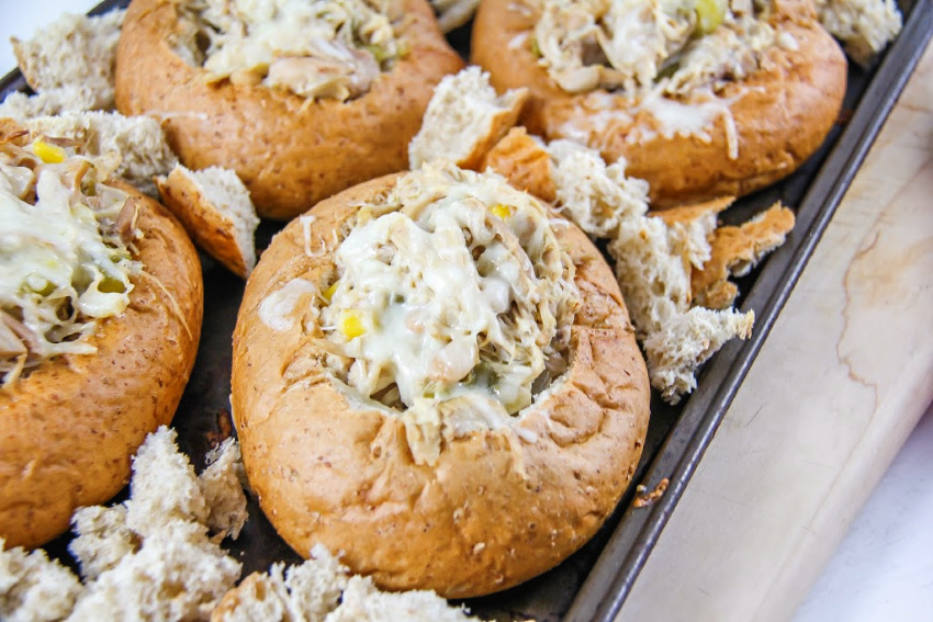 chicken chili in bread bowls on an oven tray