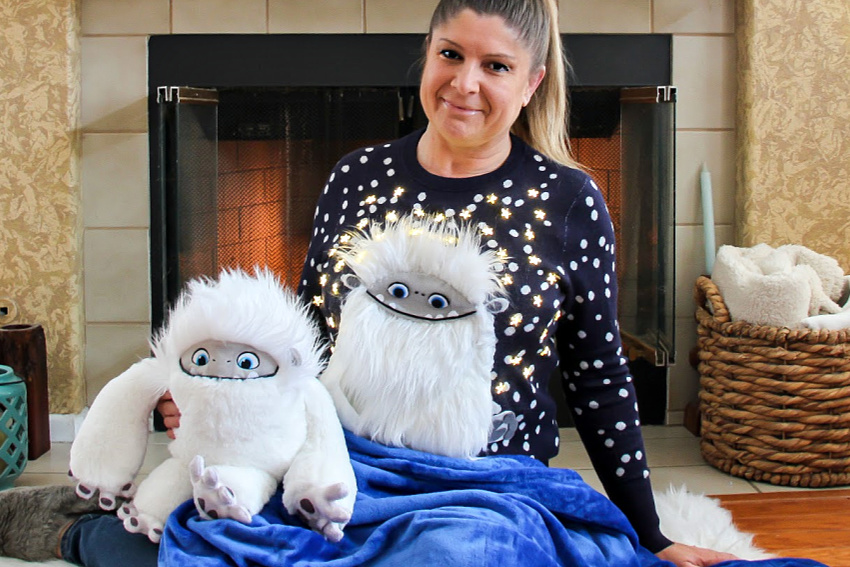 lady wearing an abominable ugly sweater with lights