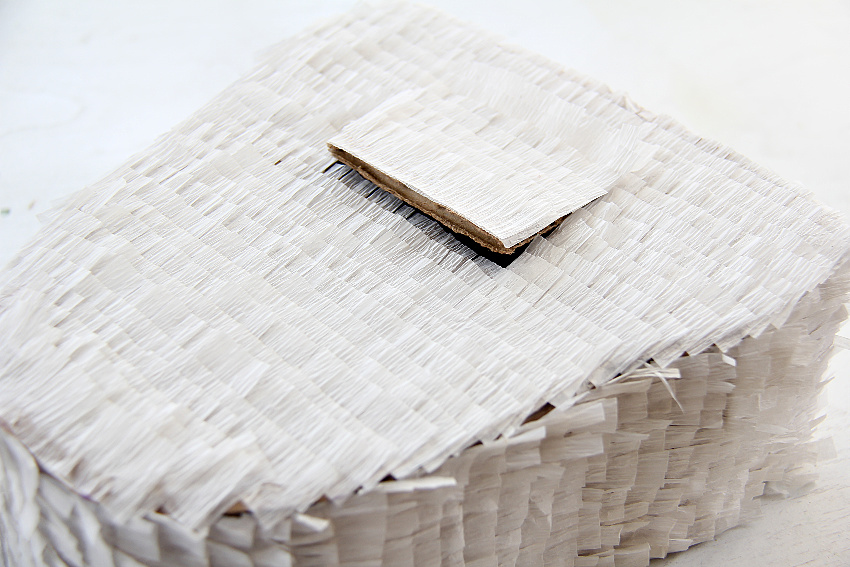 crepe paper stuck on a cardboard pinata