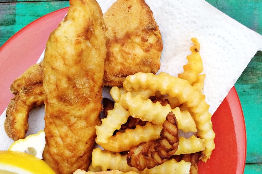 fried fish and chips on a red plate