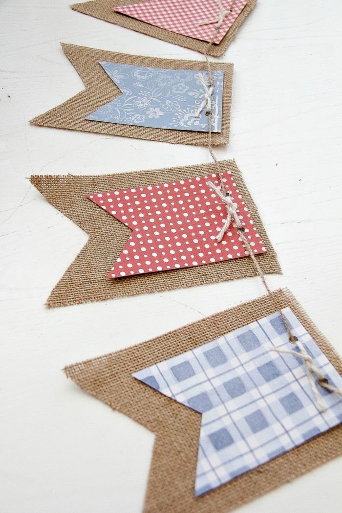 A red, white, and blue banner made with scrapbook paper and burlap for 4th of July.