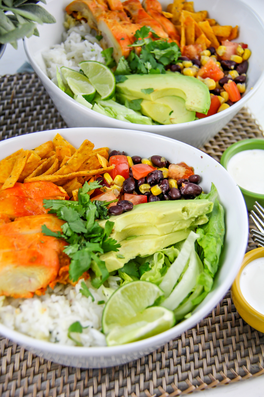 chicken taco ingredients with rice and avocado in bowls