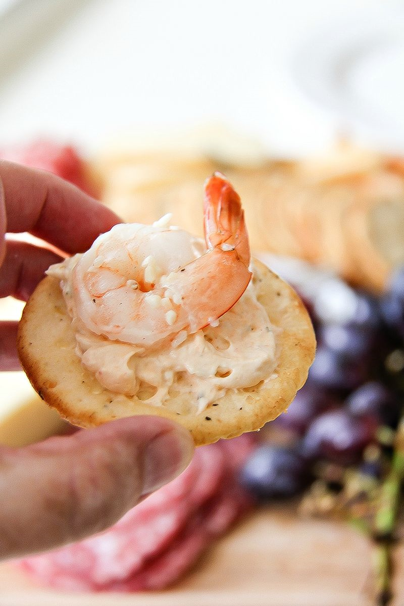 shrimp and cream cheese spread on a cracker